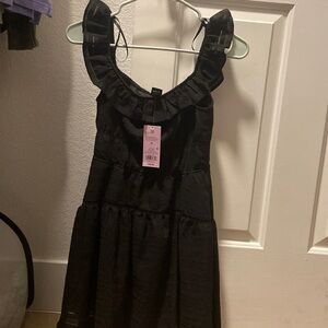 Black sleeveless mini dress